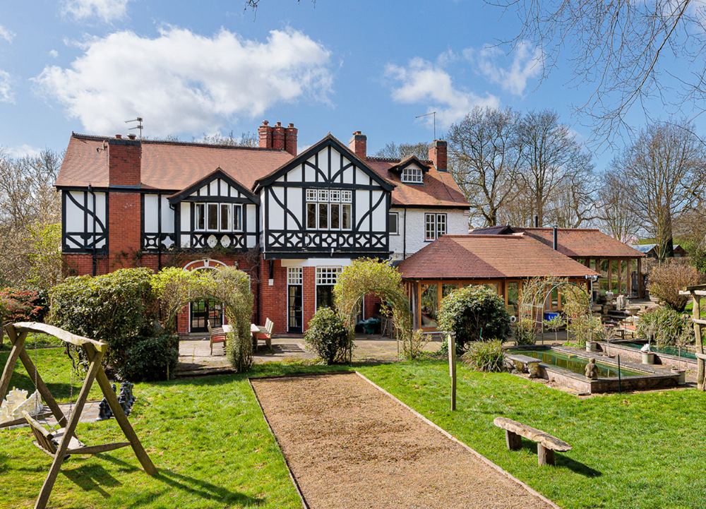 A timber-framed detached house with garden